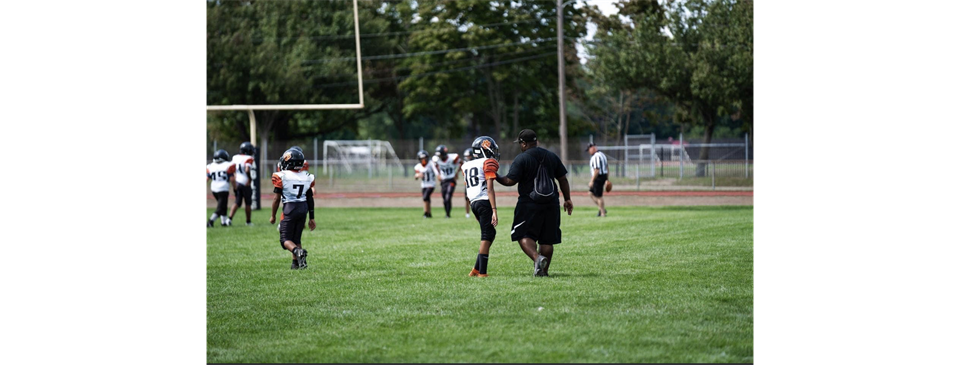 Coach Ty and Derrick discussing the next play!